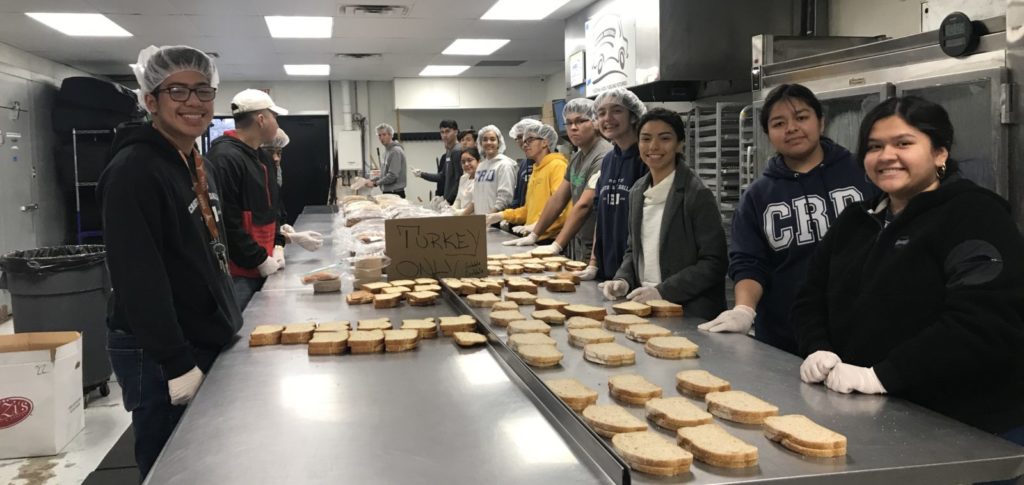 students making sandwiches